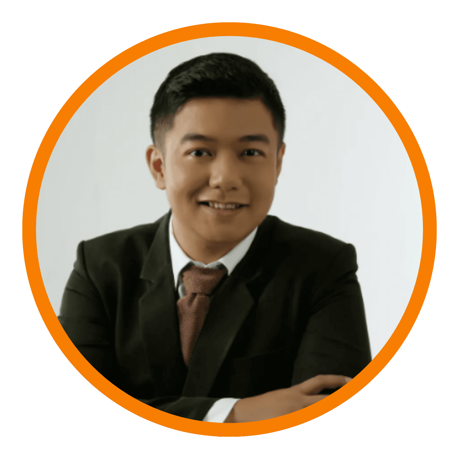 Man in suit smiling, framed in orange circle.